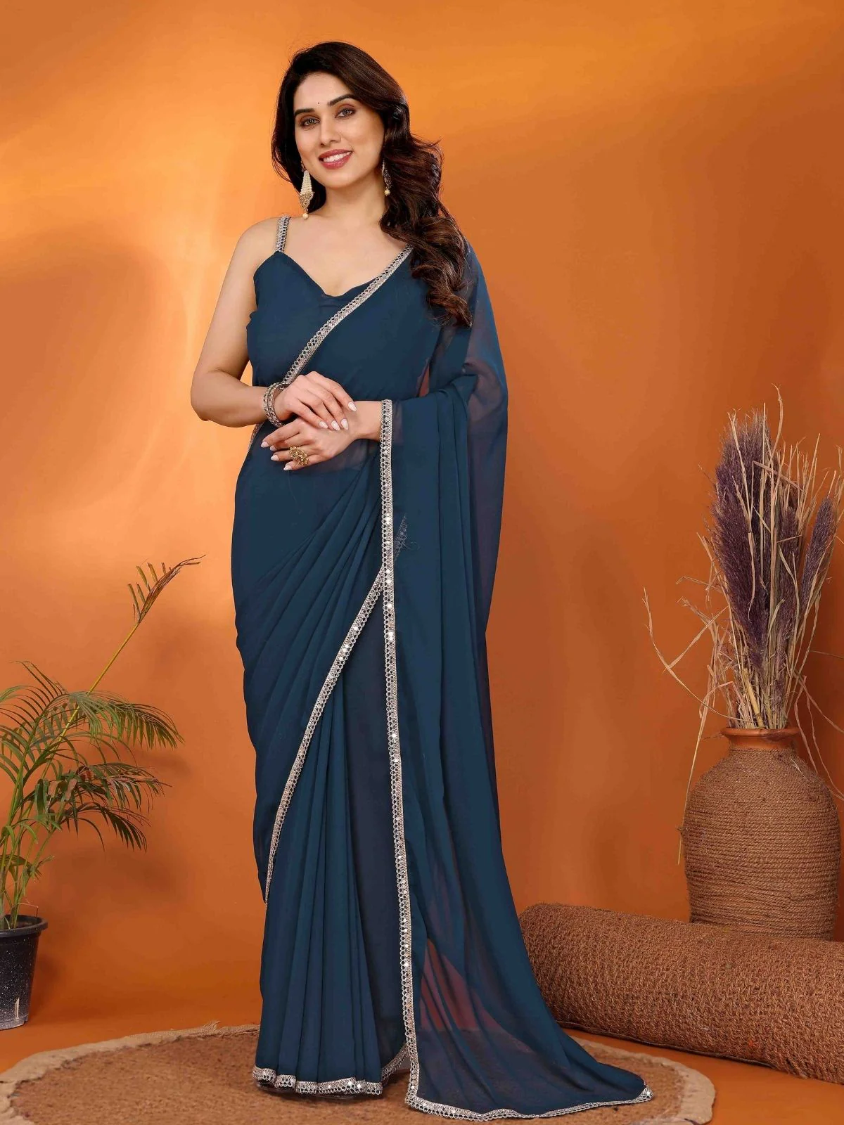 Odette Blue Georgette Plain Saree With Unstitched Blouse For Women
