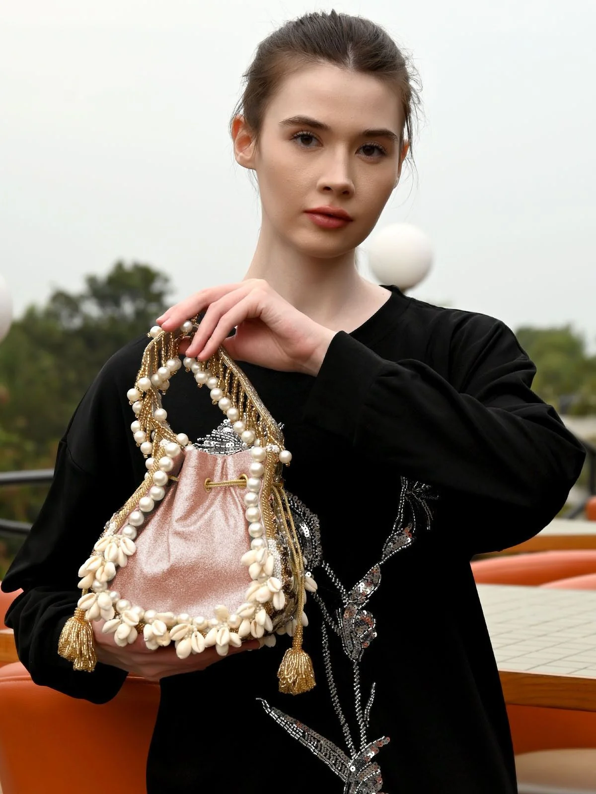Odette Peach Gliter Embellished Potli For Women