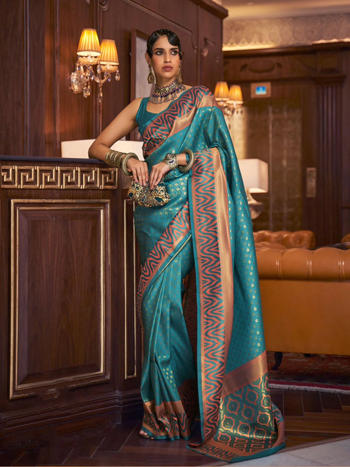 Odette Teal Woven Design Silk Blend Saree With Unstitched Blouse For Women
